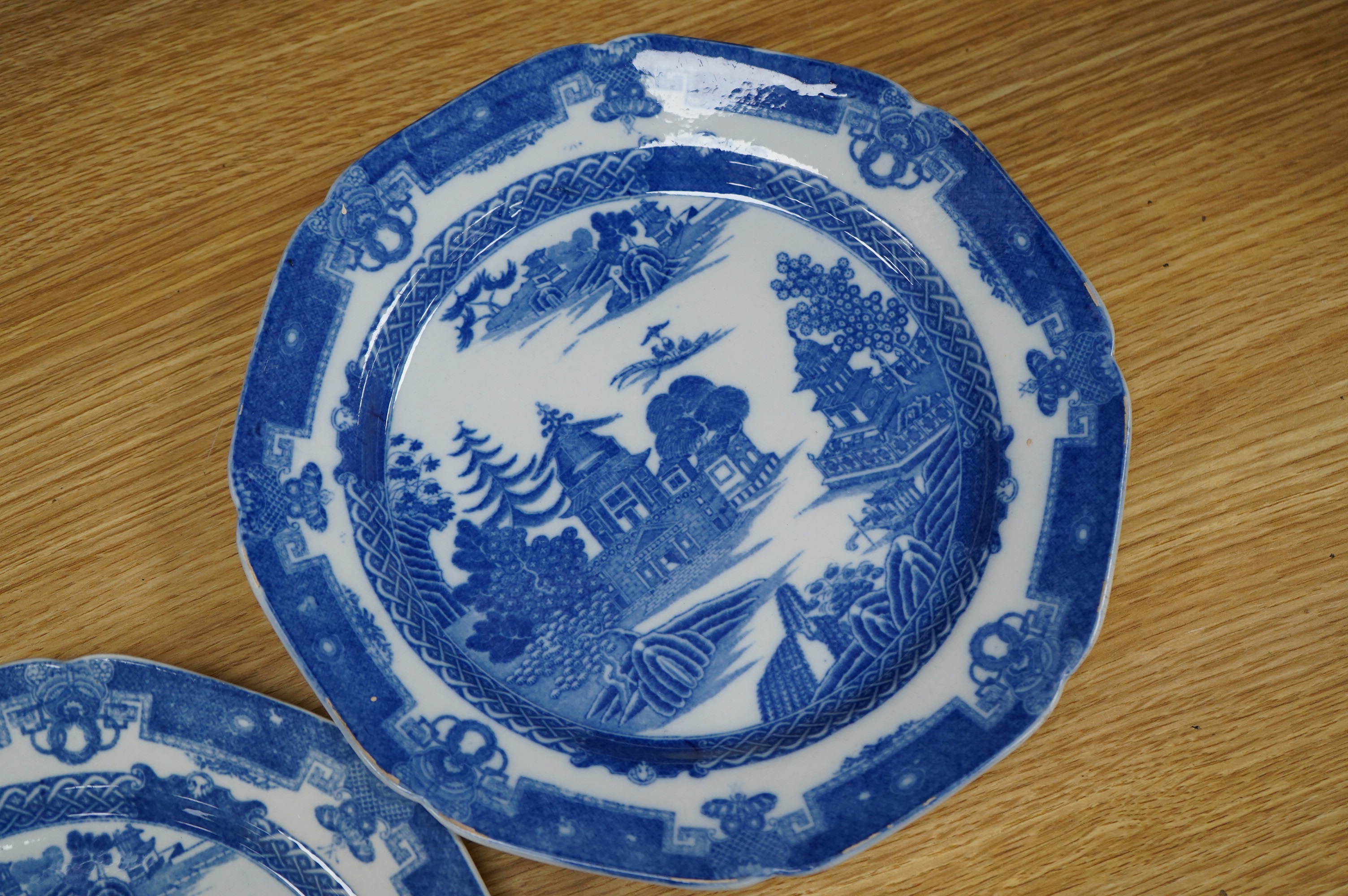 Four early 19th century English pearlware blue and white plates, largest 23.5cm. Condition - fair